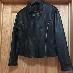Ladies, Unik heavy leather jacket
Size small in good condition